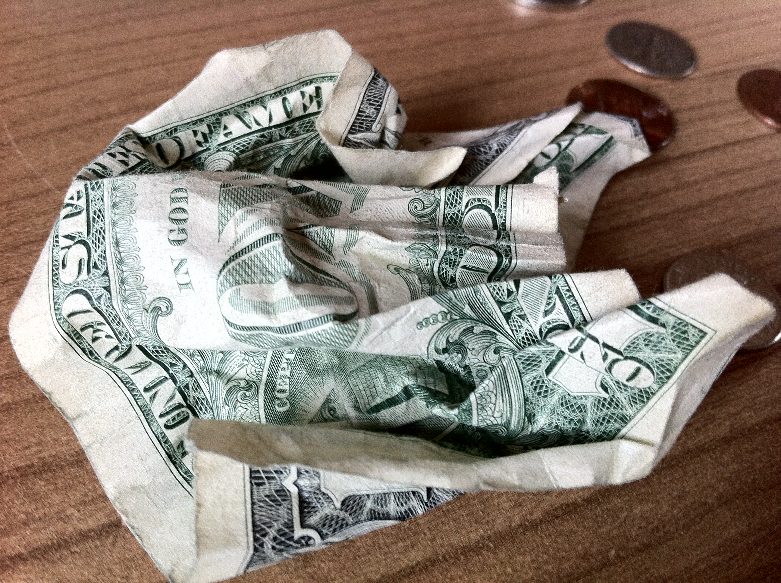 Torn one dollar bill